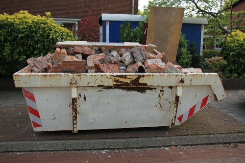 Professional furniture clearance team in Enfield working on a living room