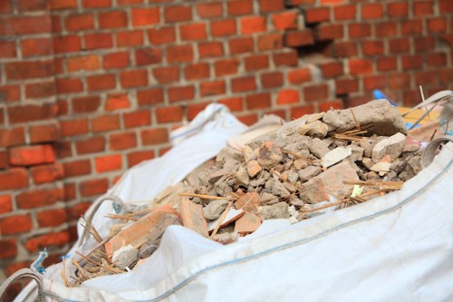 Workers segregating construction waste materials